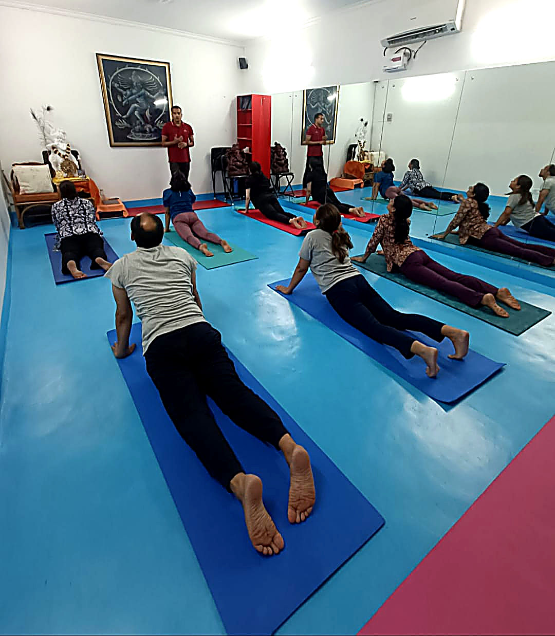 Group yoga class led by Dr. Vijay Ojha